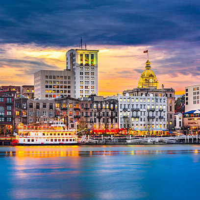 Savannah, Georgia, USA skyline on the Savannah River at dusk.